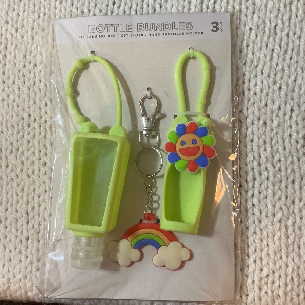 Target Bright Green Key chain lip balm and sanitize Holders rainbow flower